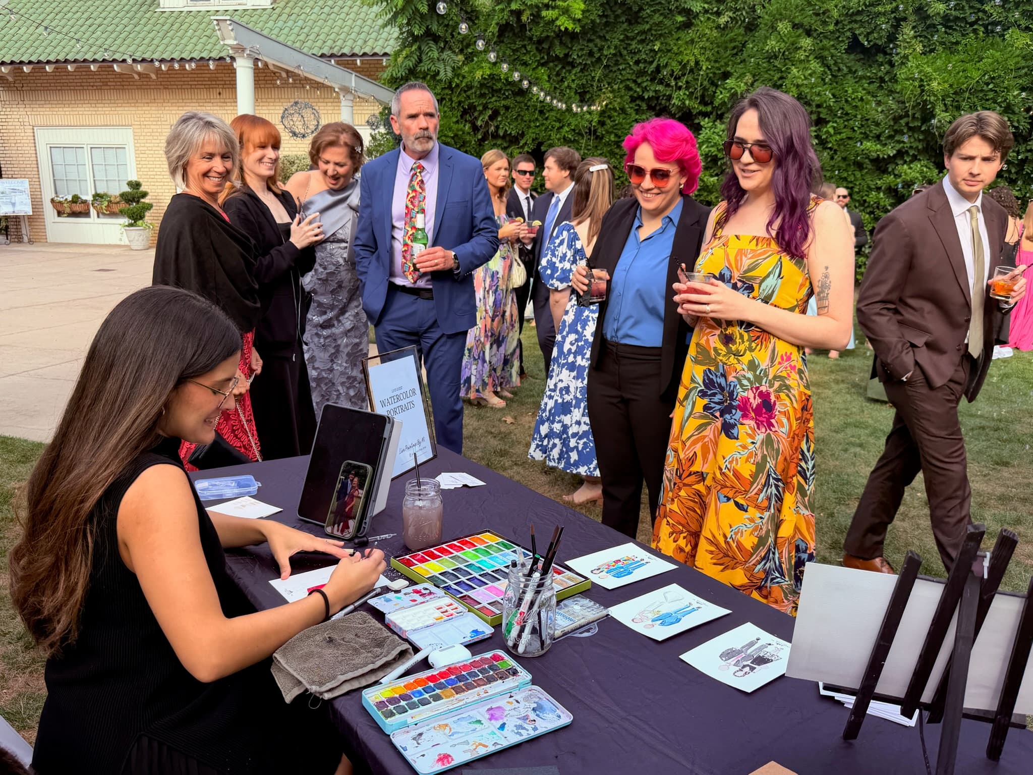Miriam painting at a wedding