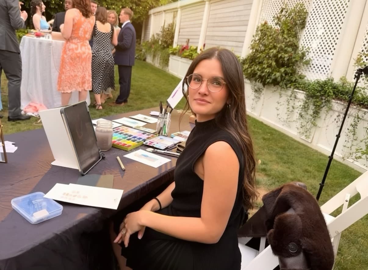 Miriam painting at a wedding