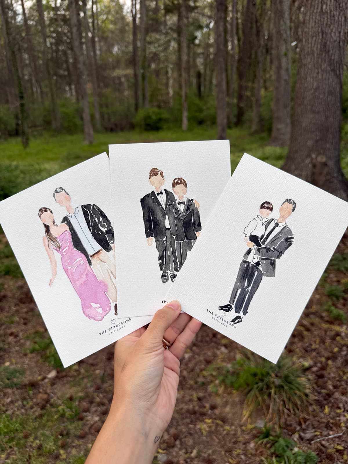 Live watercolor wedding portrait beneath a tree
